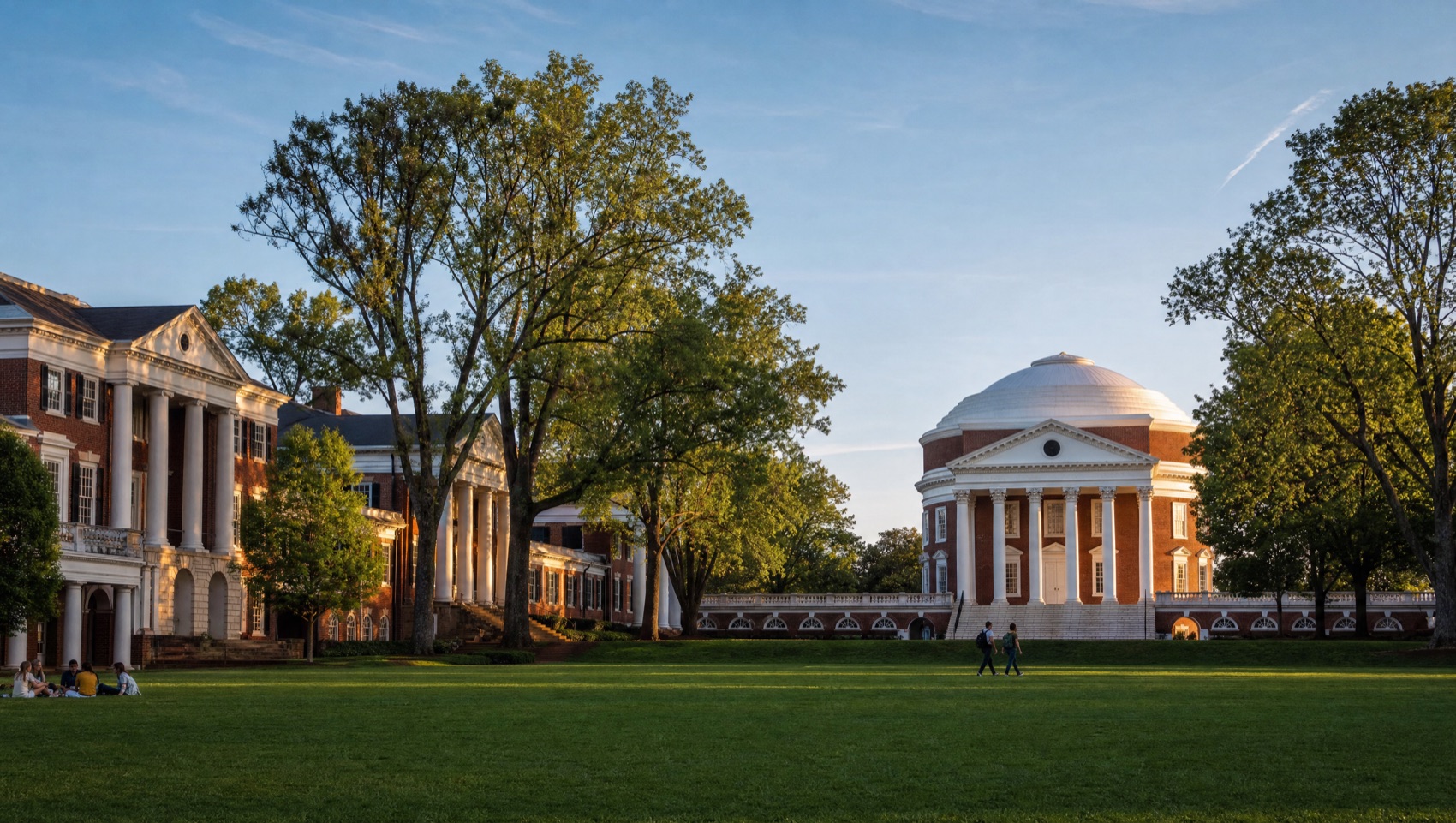 Jeffersonian red-brick and white-column university architecture on a green lawn